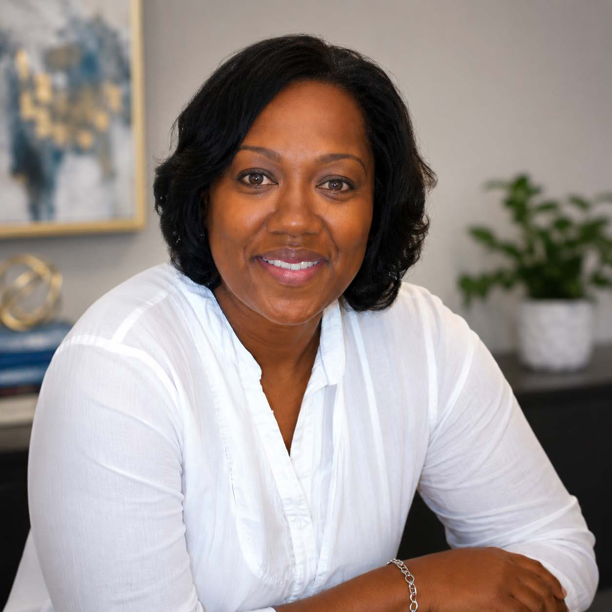 Dr. Veronica Williams Parish, founder of Parish Educational Consulting, seated in a studio portrait